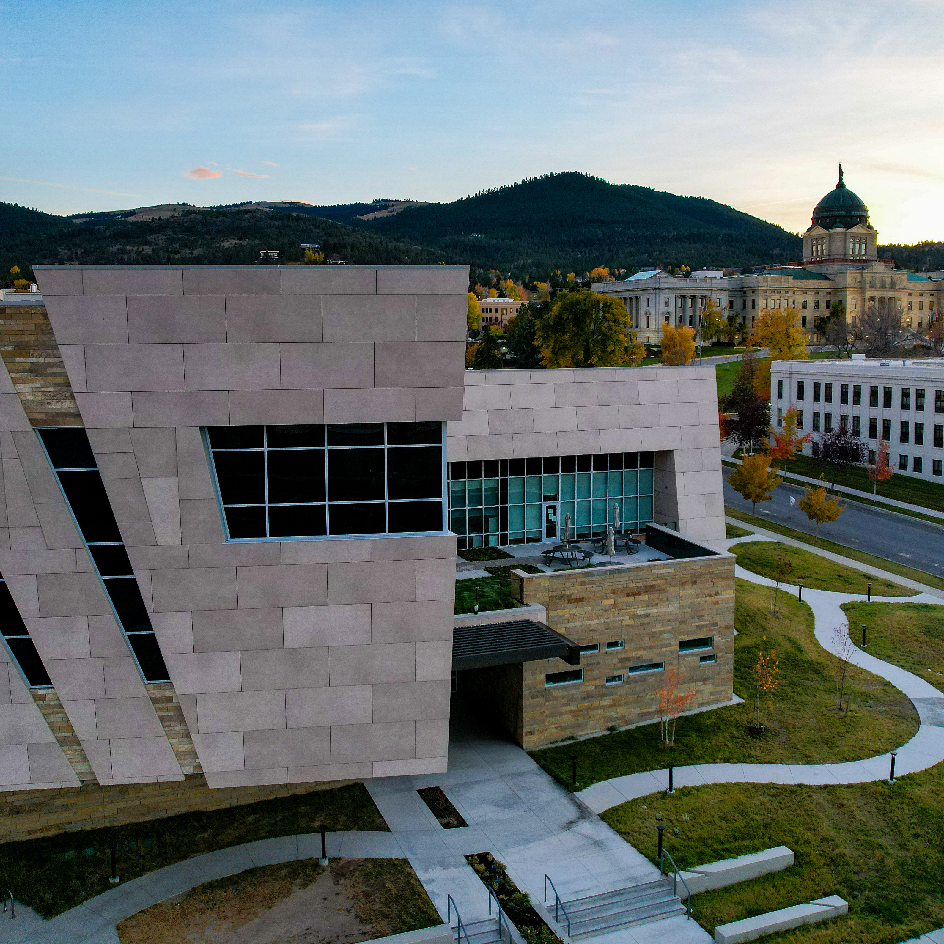 An image of the exterior of the Montana Heritage Center with clouds in a blue sky.