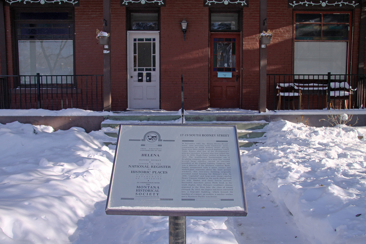 View of a brick building with a National Register sign.